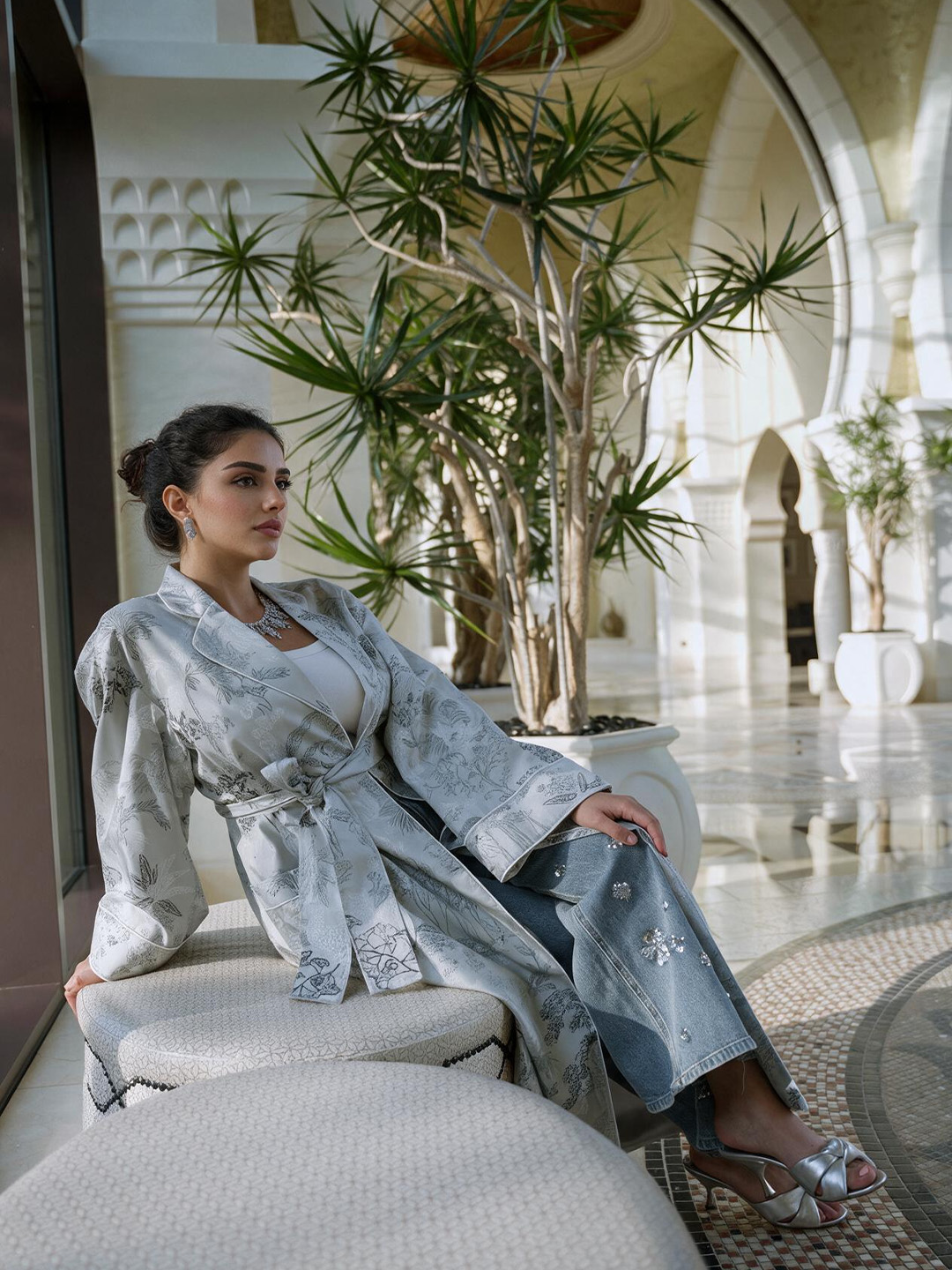 Seated beneath the palms of the atrium